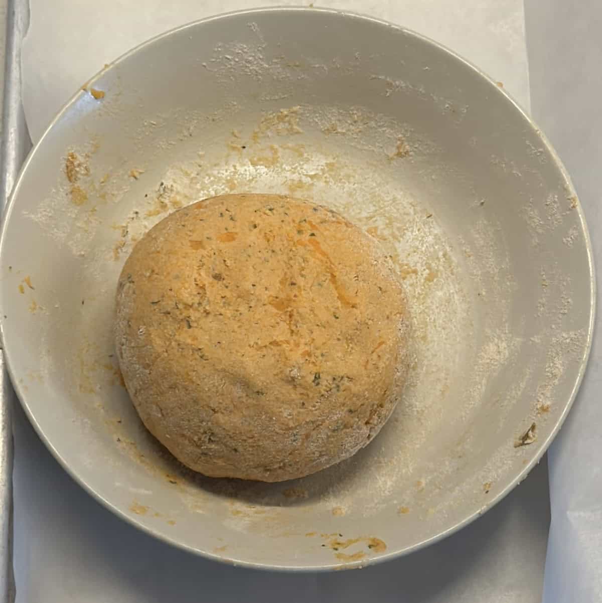 Smooth dough ball of sweet potato and amaranth flour in a bowl. 