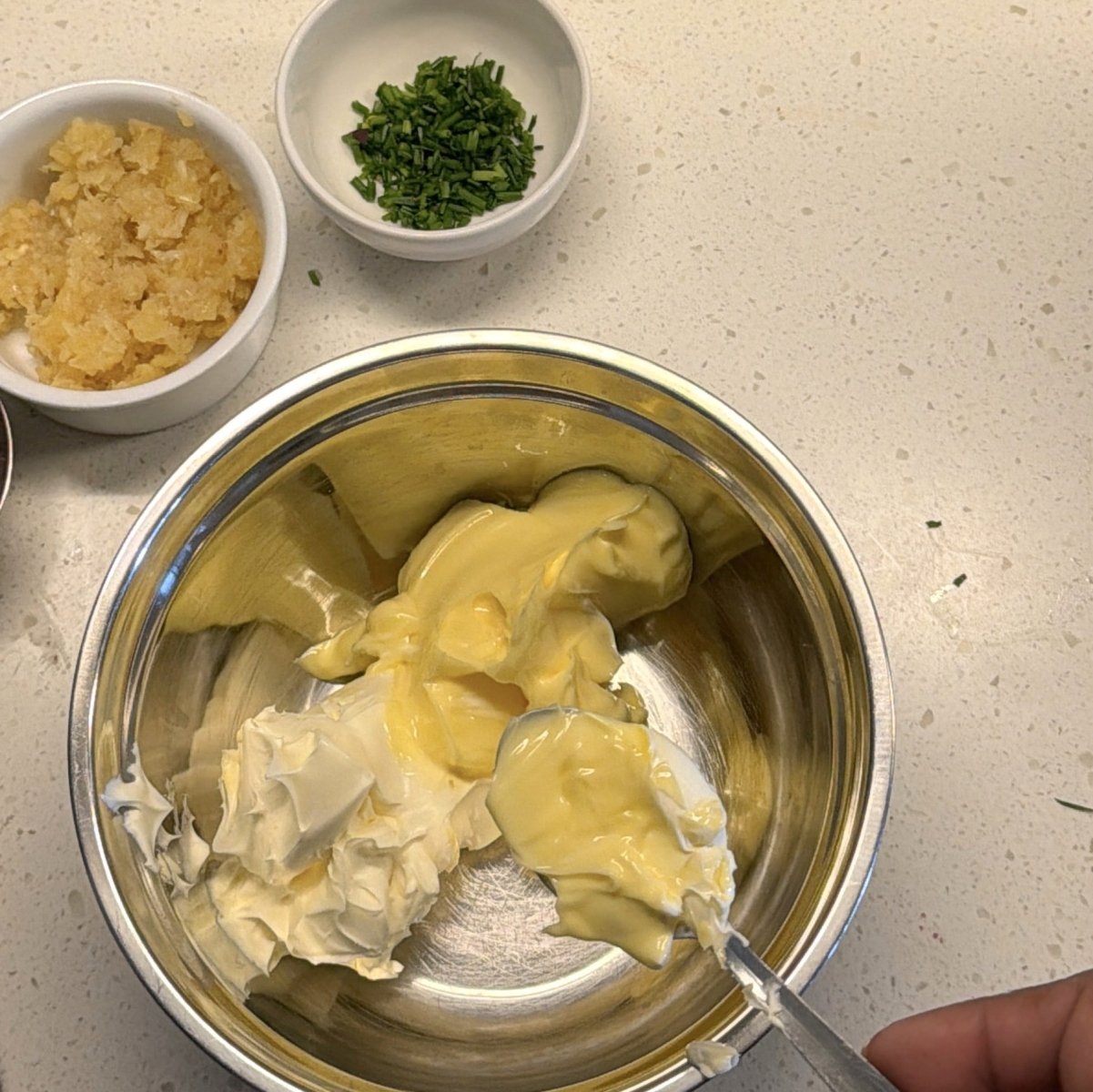 Butter and spread with garlic and chives ready for mixing