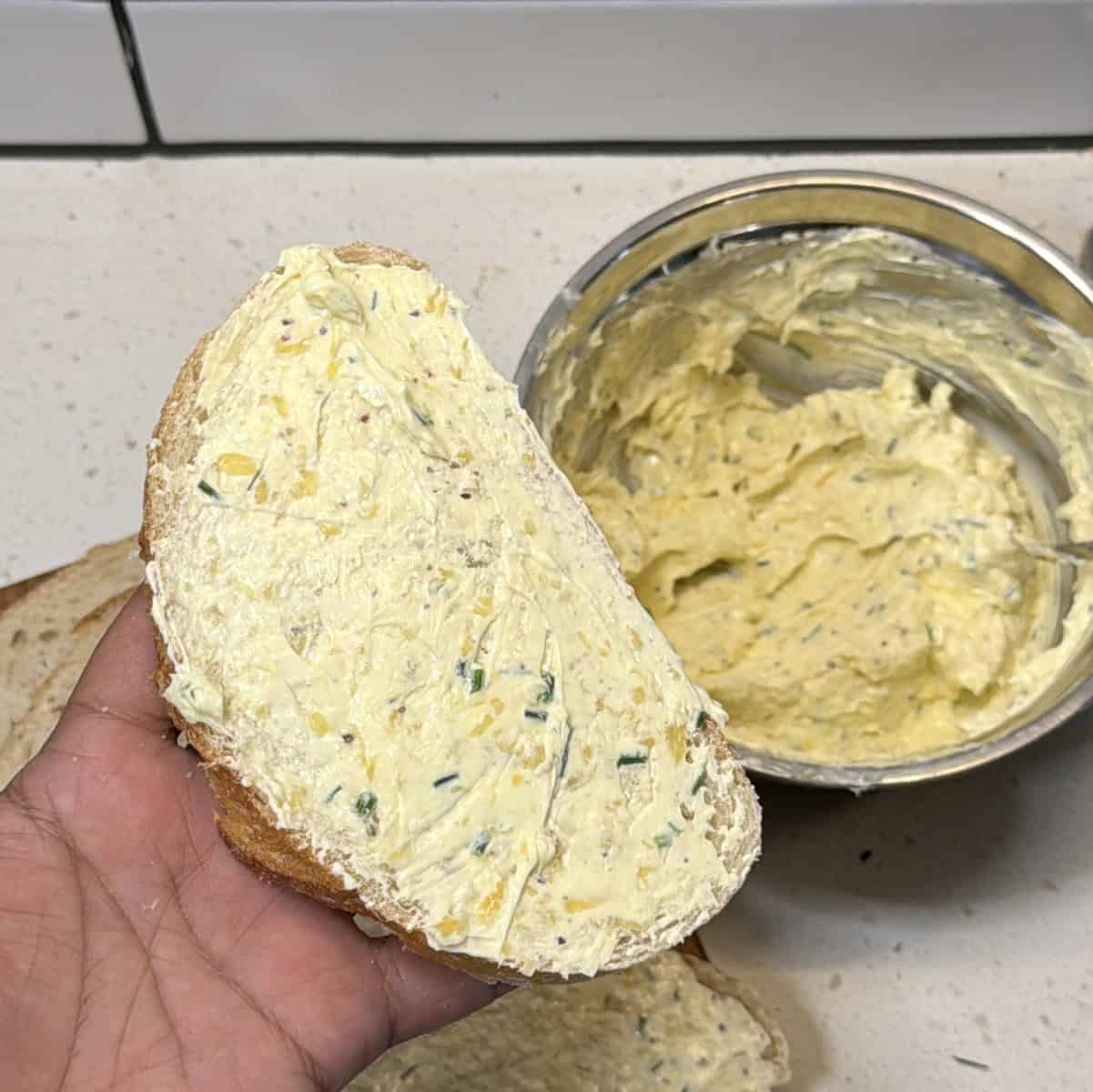 Garlic butter spread applied on bread slice