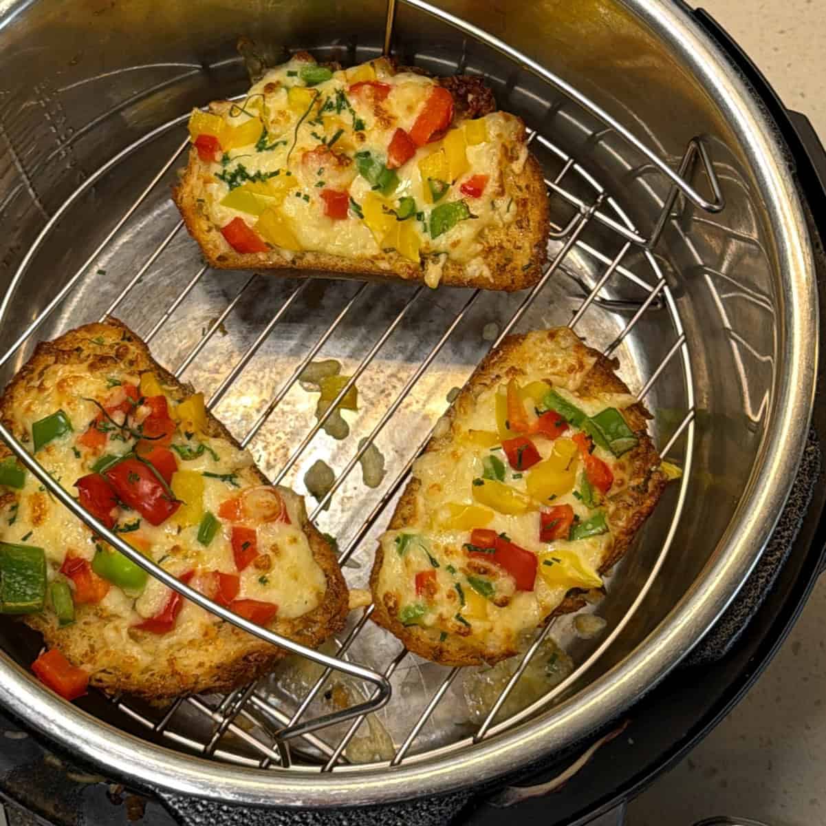 Air fryer chilli cheese toast with melted cheese and colourful capsicum