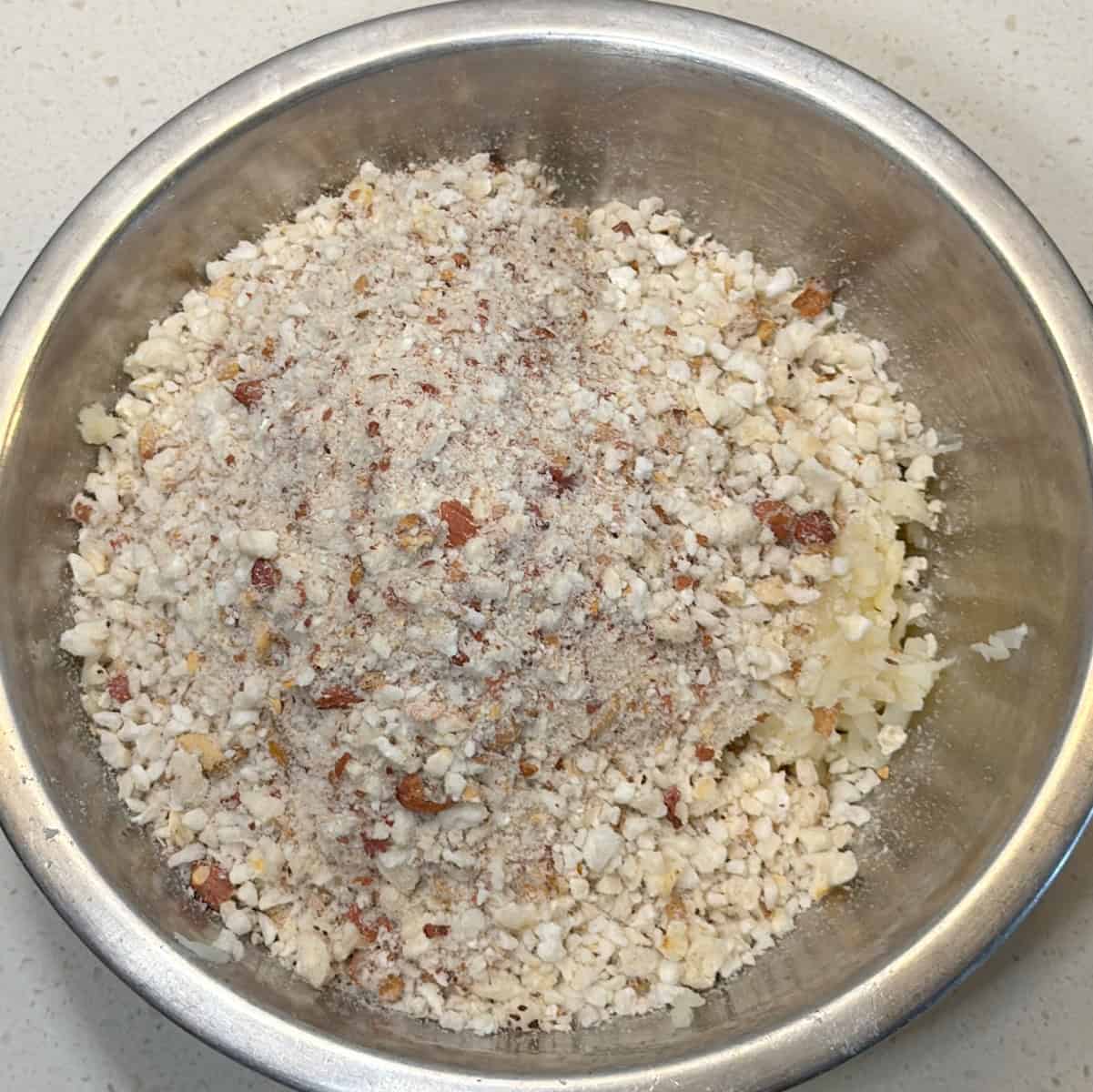 Combine coarse makhana-peanut mixture with grated potato in a mixing bowl