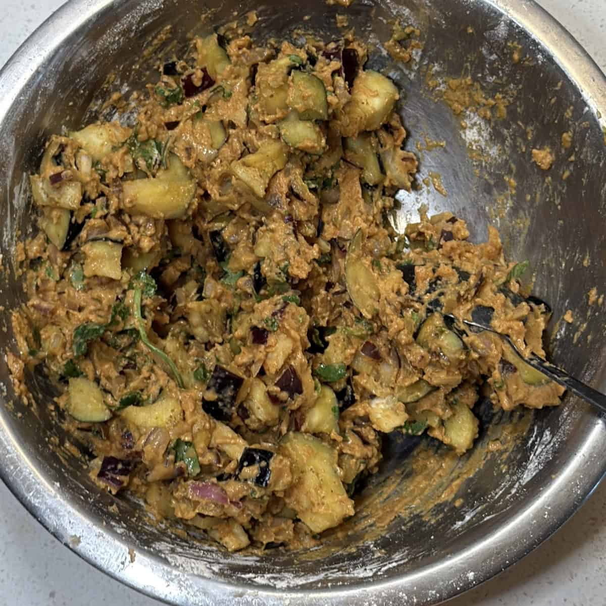 Thick eggplant pakora mixture ready for air frying