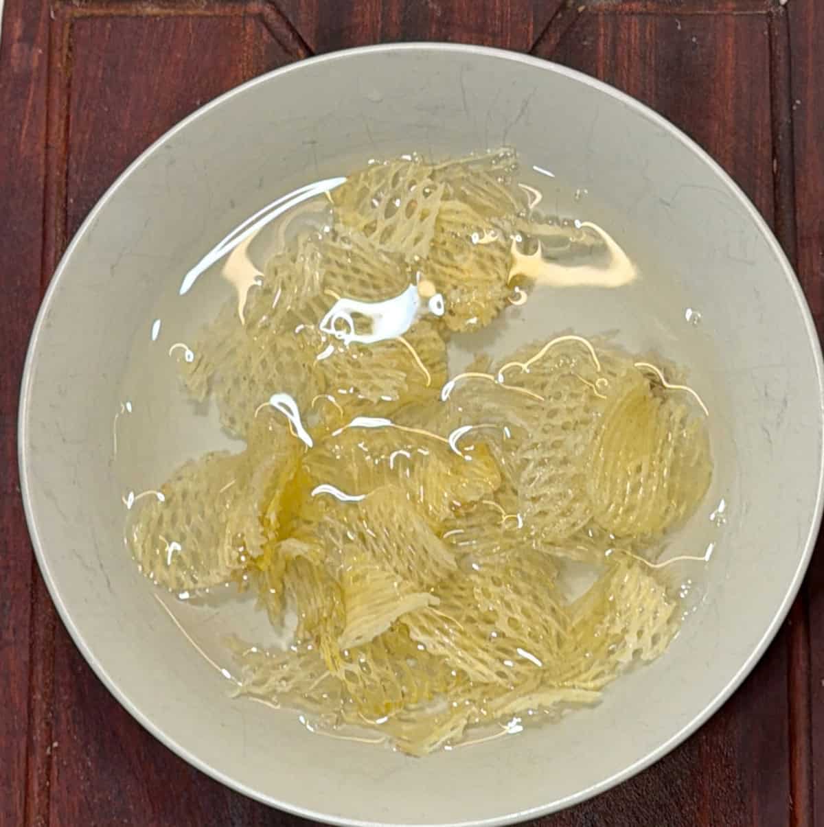 Potato chips soaked in water for dry fruit chivda recipe