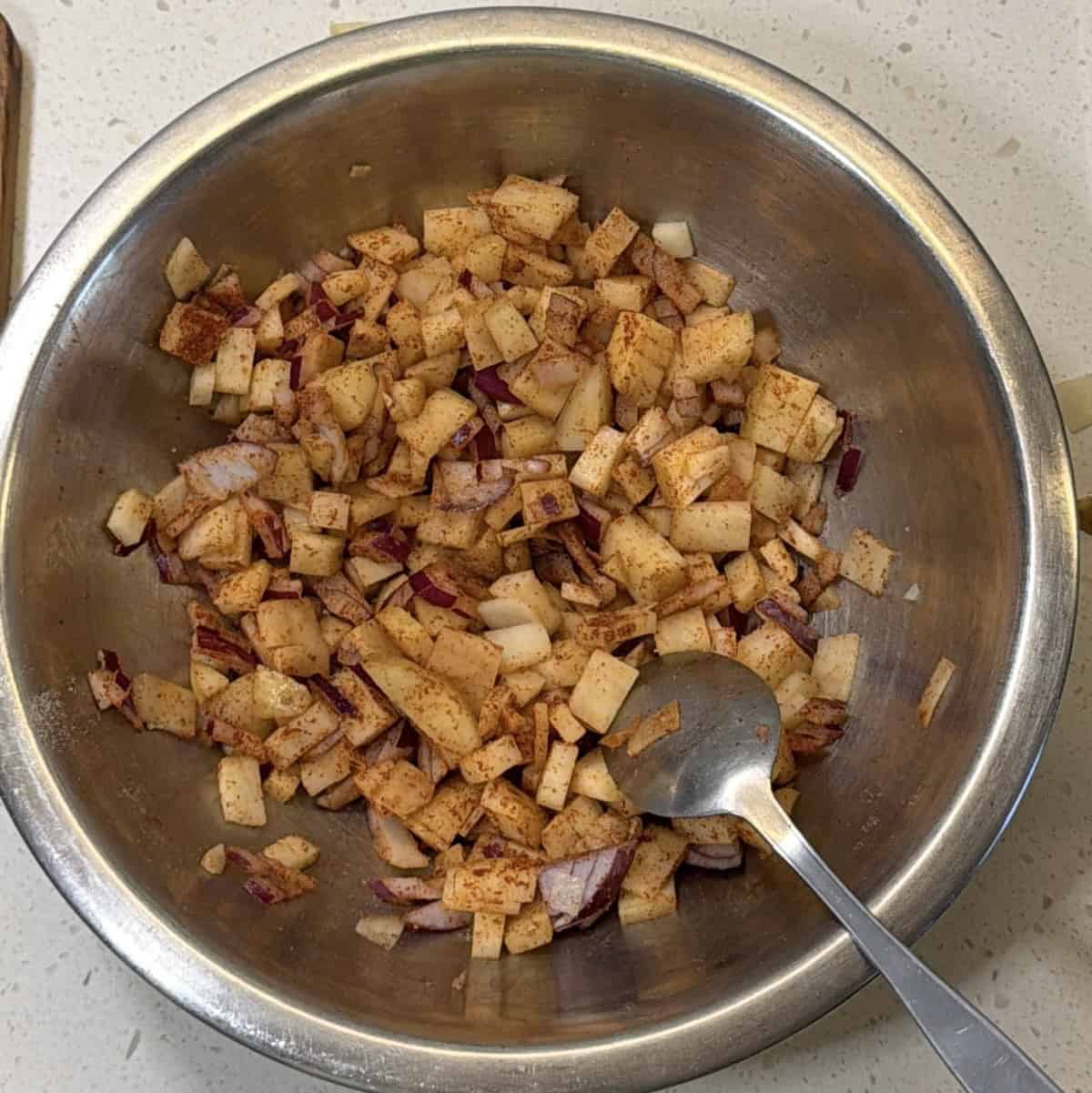 Potato and onion mixed with spices for air fryer pakora