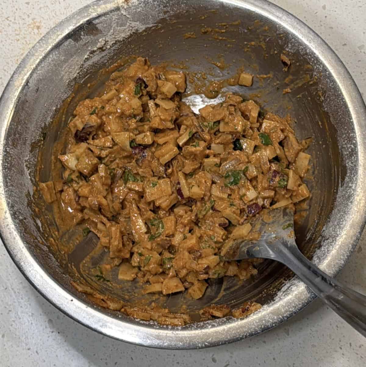 Thick potato pakora mixture ready for air frying