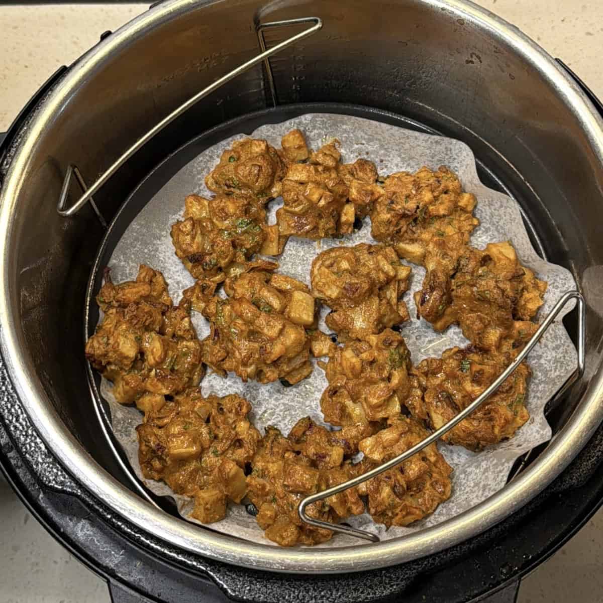 Crispy air fryer potato pakora cooked until golden