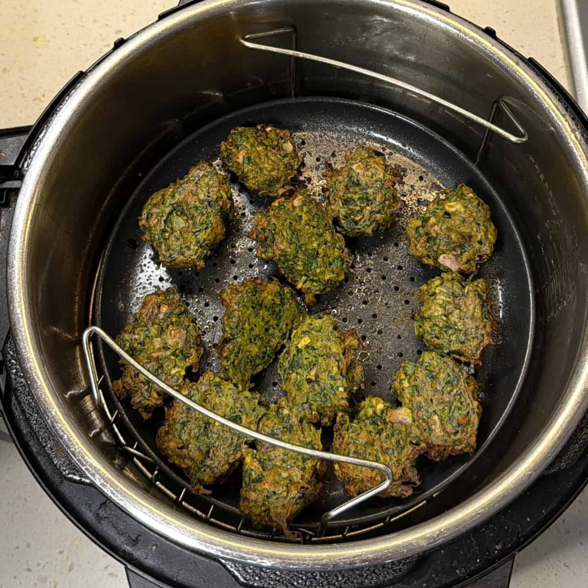 Crispy air fryer spinach pakora cooked until golden around the edges