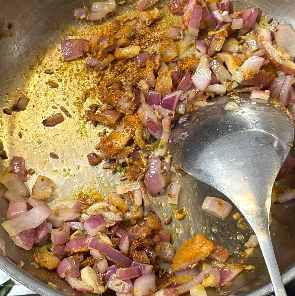 Onion masala with spices for paneer puff filling