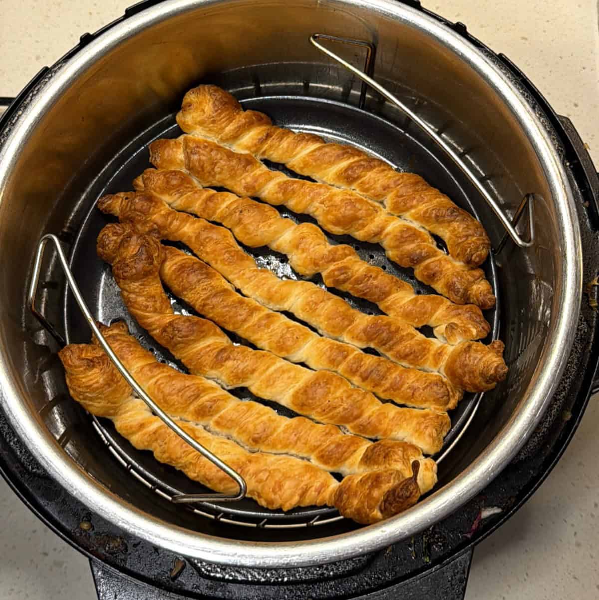 Golden brown vegan puff pastry twists cooked in air fryer