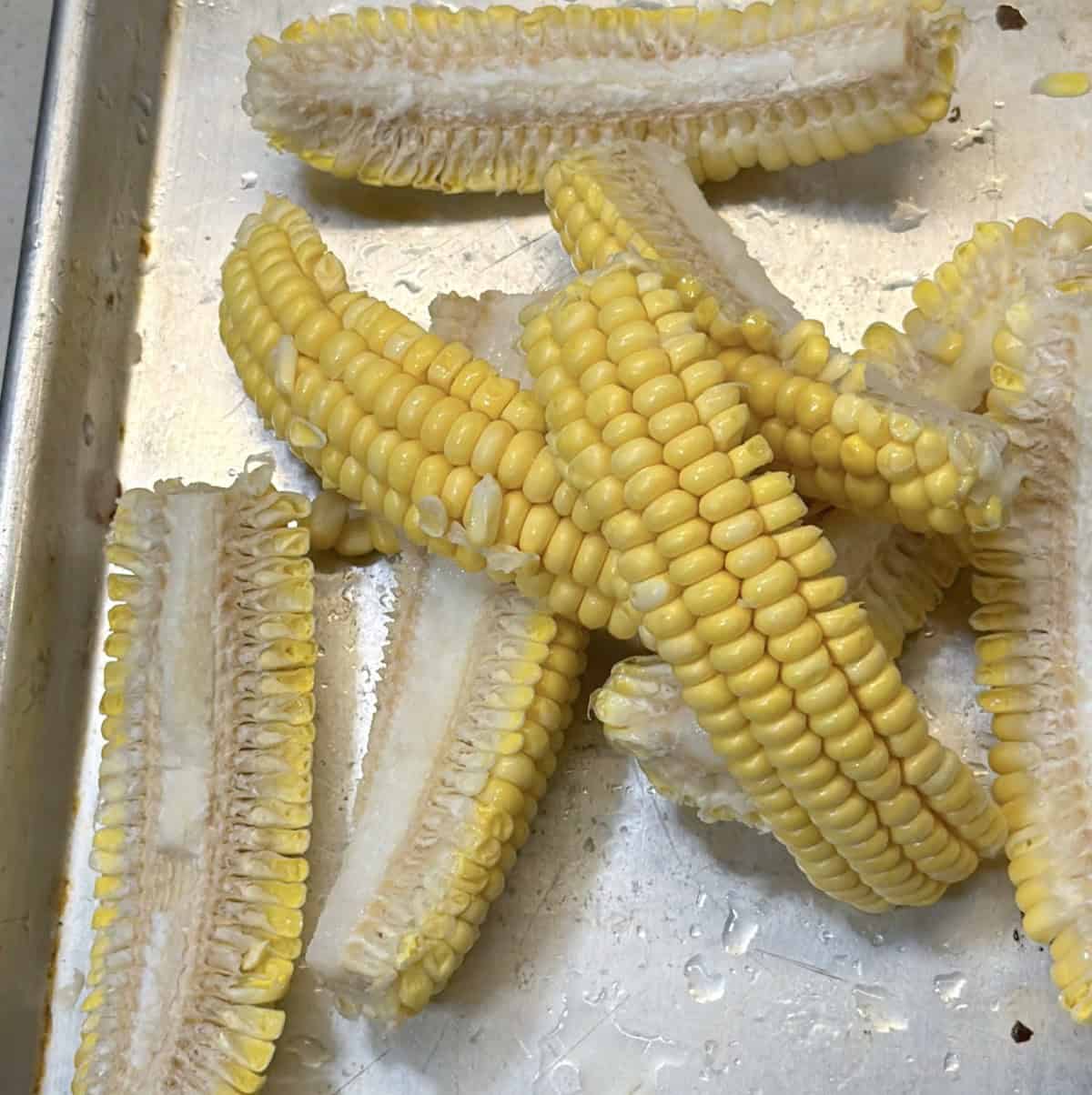 Raw corn cut lengthwise into ribs for air fryer corn ribs