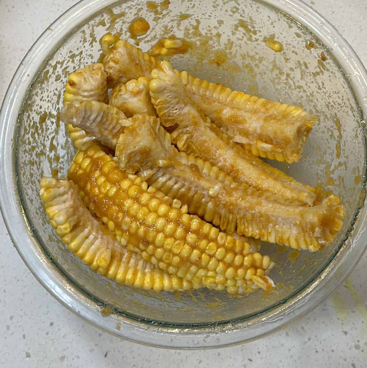 Corn ribs tossed with seasoning paste before air frying