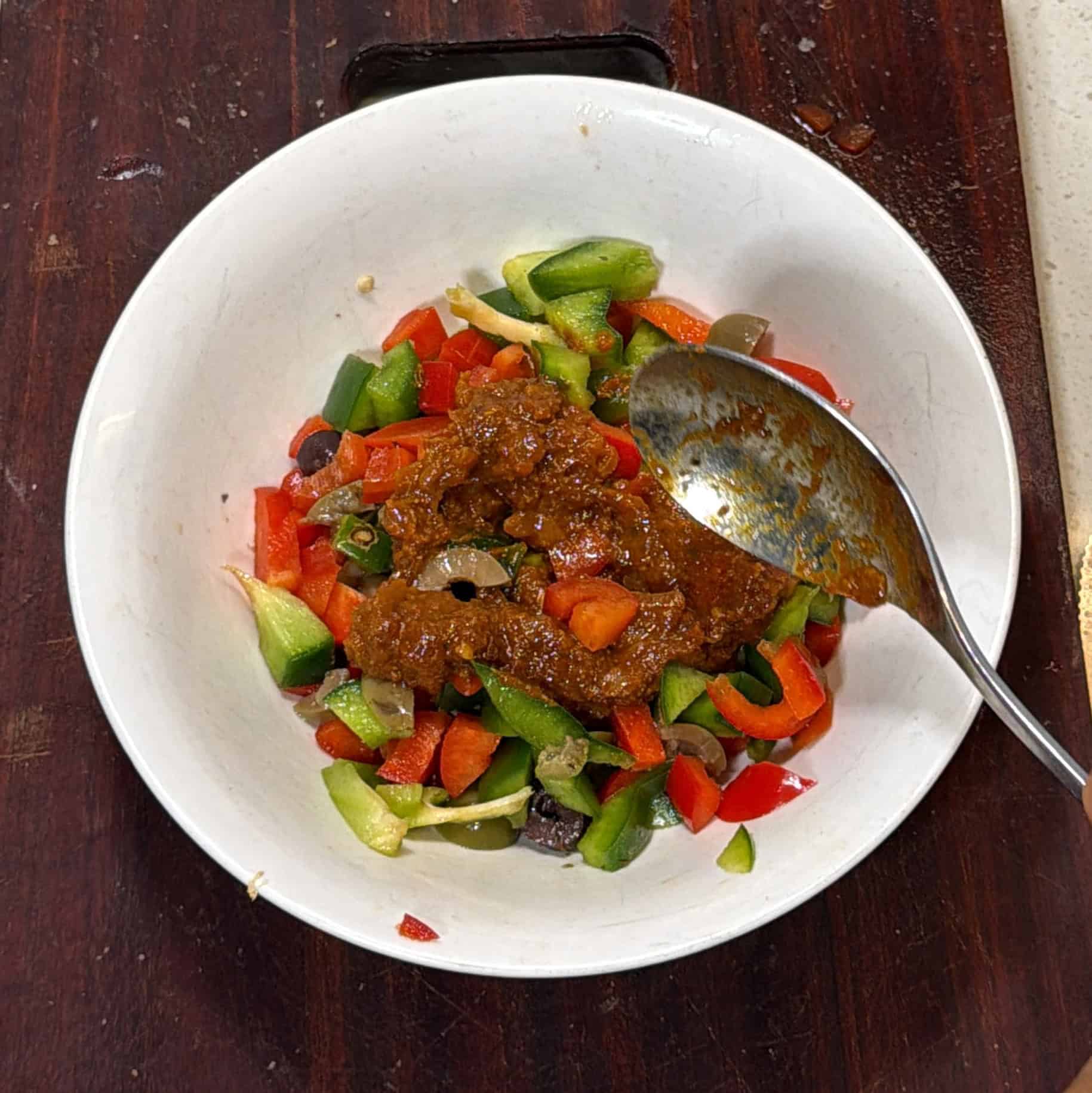 Pizza sauce added to chopped peppers for air fryer pizza puffs