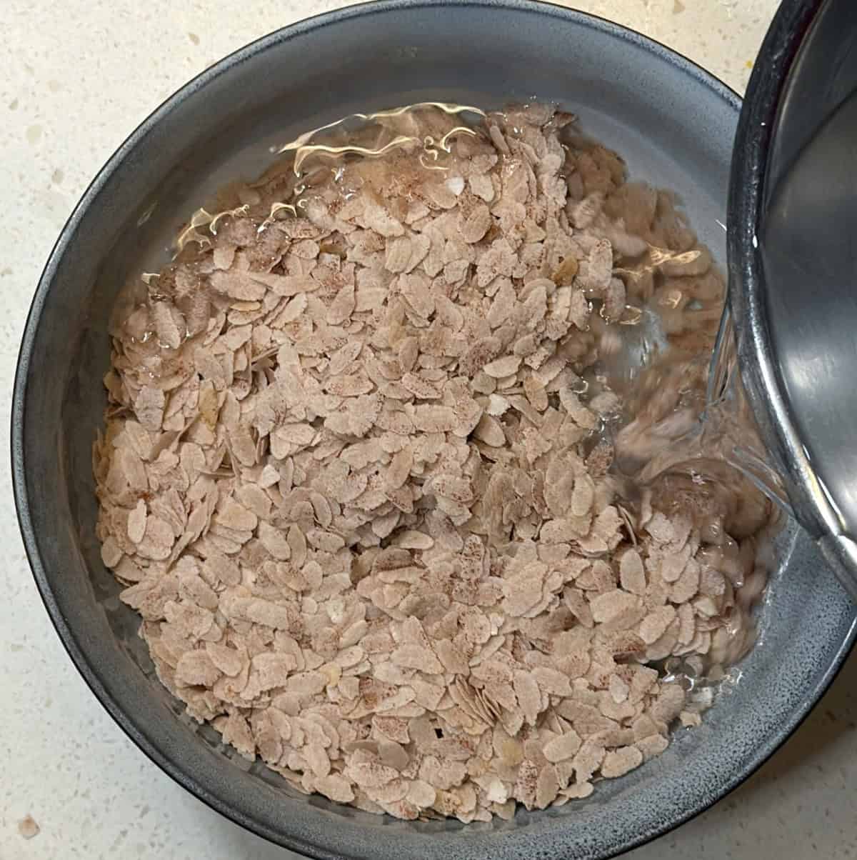 Poha soaking in water for poha cutlet in air fryer