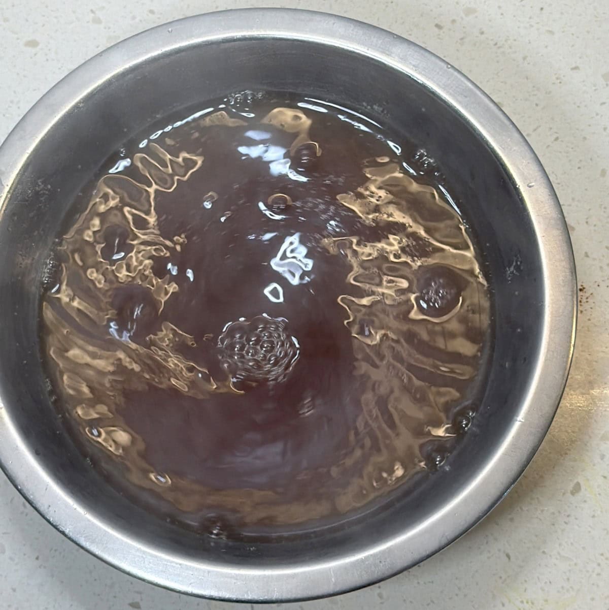 Seasoned hot water for soaking soy chunks for vegan popcorn chicken