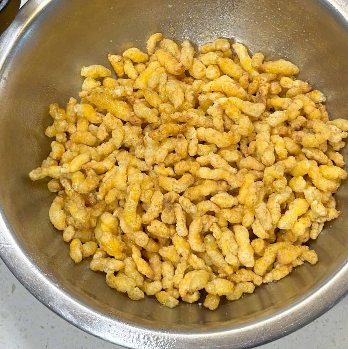 Puffed corn in a mixing bowl for air fryer puffed corn recipe