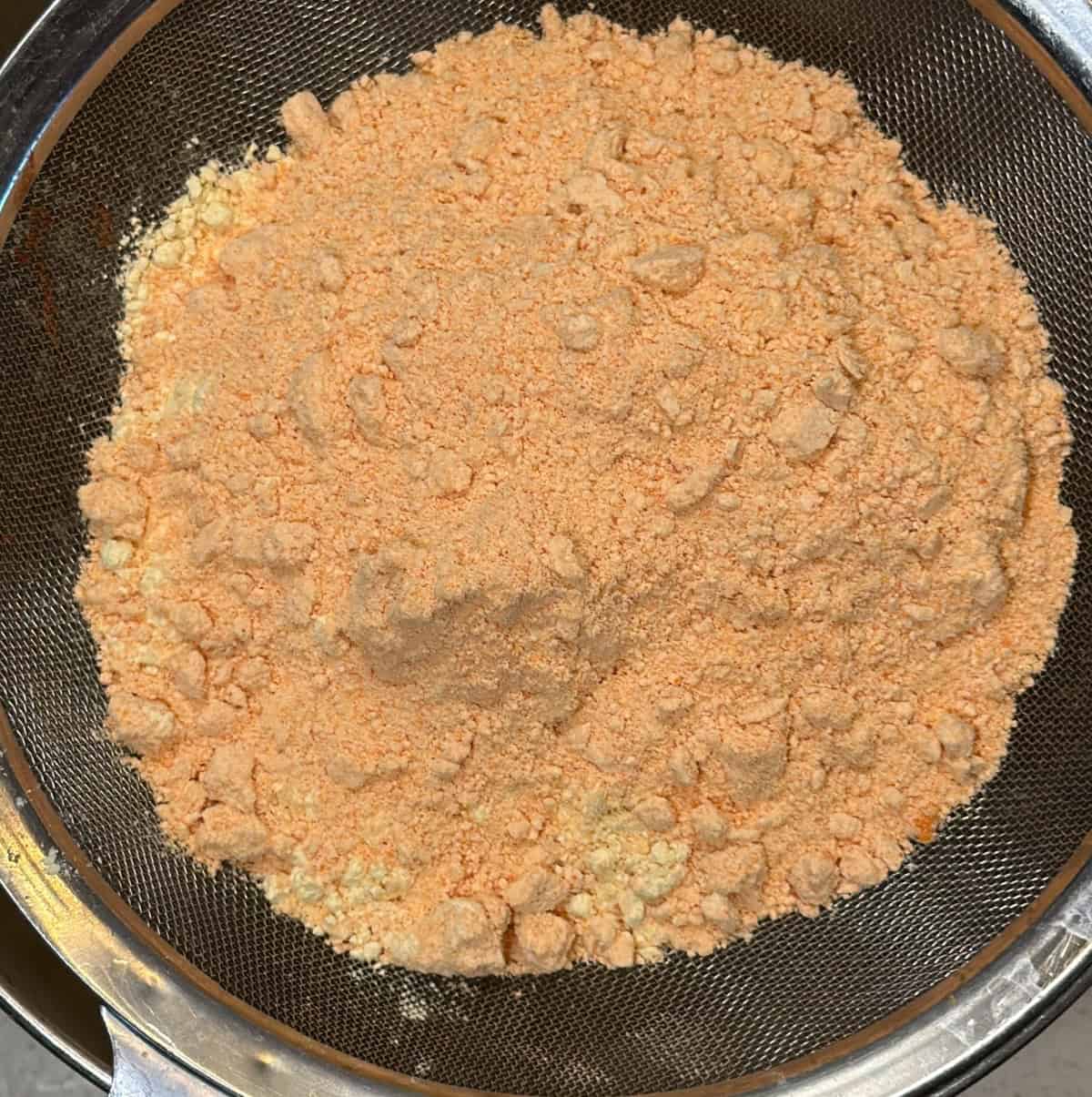 Sifted besan and red lentil flour ready for fafda dough