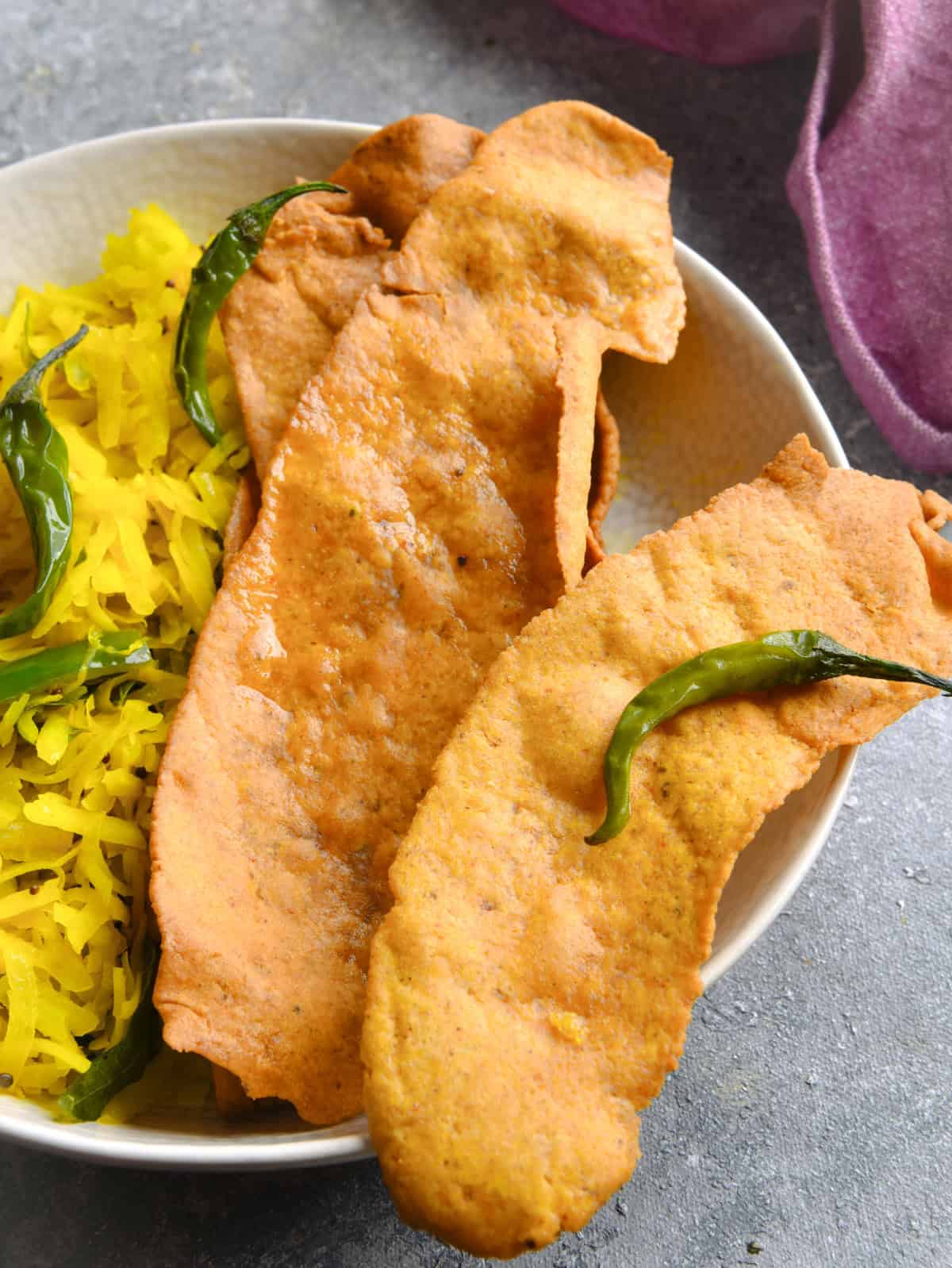 Golden homemade air fryer fafda served with green chillies