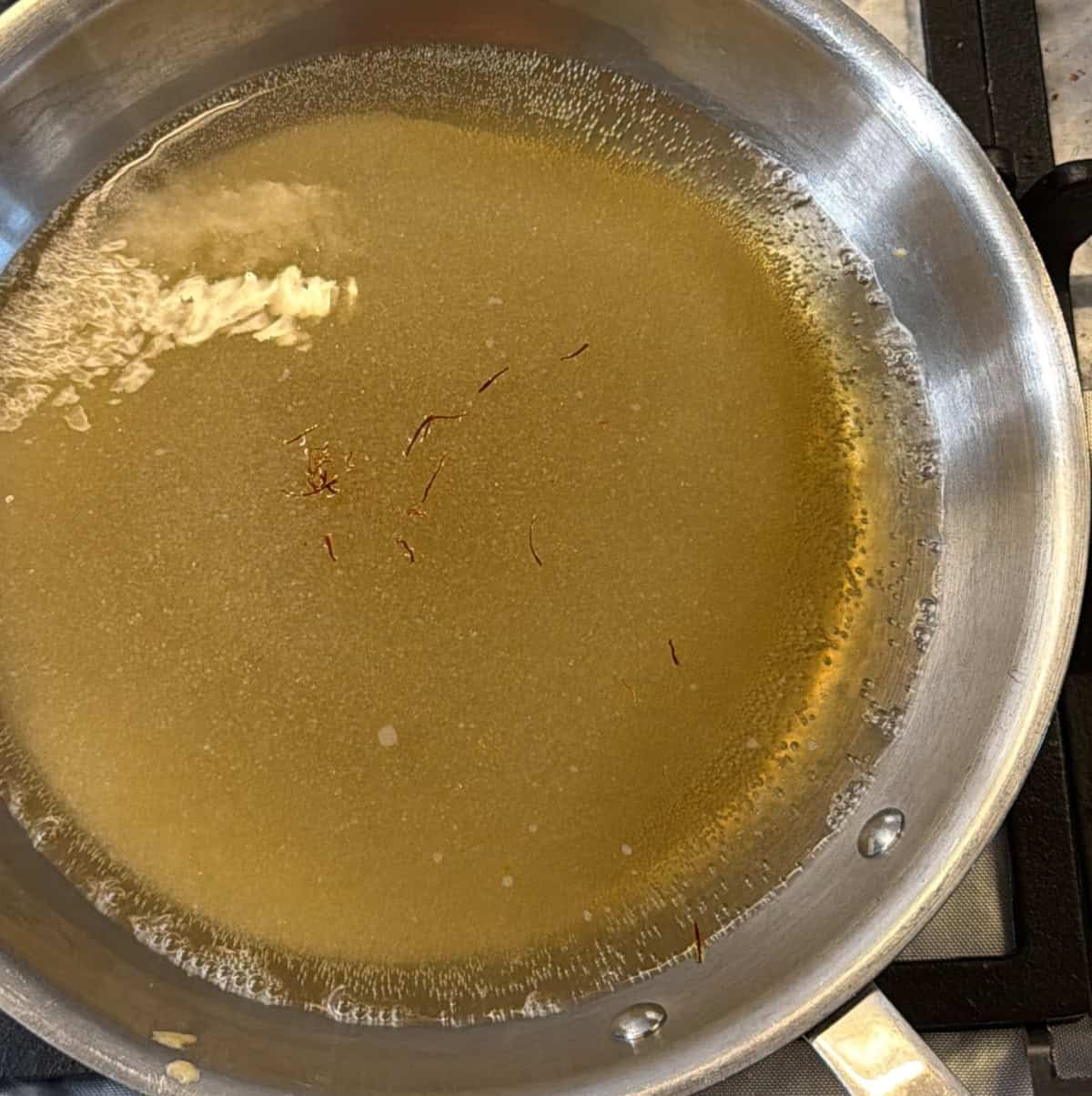 Sugar and water combined to make sugar syrup for air fryer jalebi