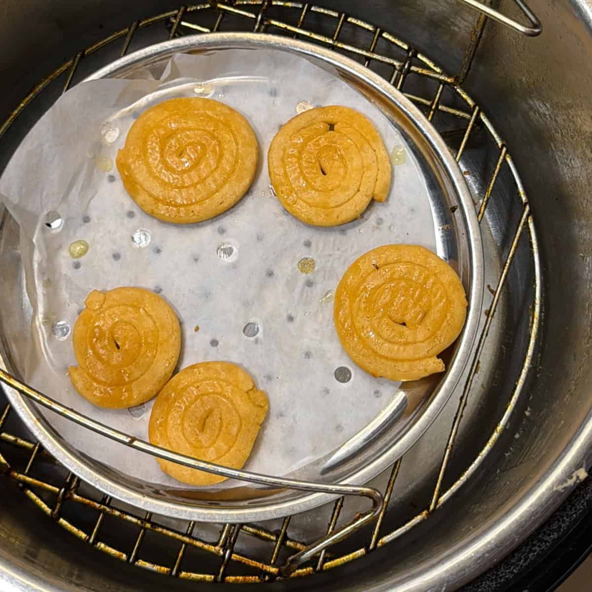 Jalebi flipped and brushed with ghee inside the air fryer