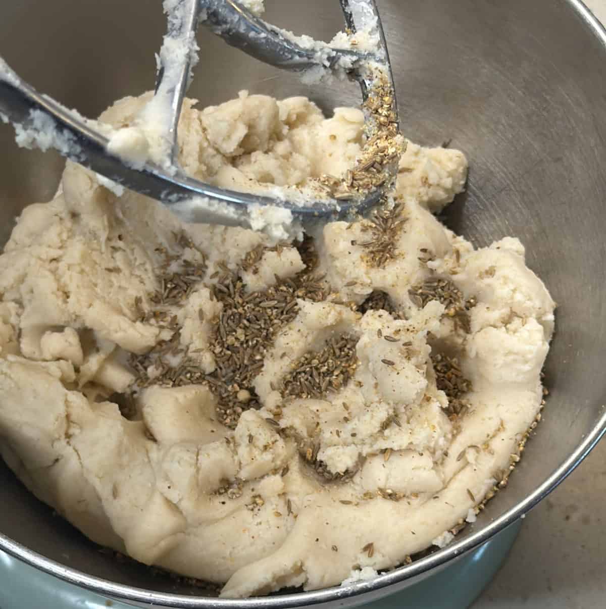Boiled murukku dough re-kneaded with cumin seeds and white pepper