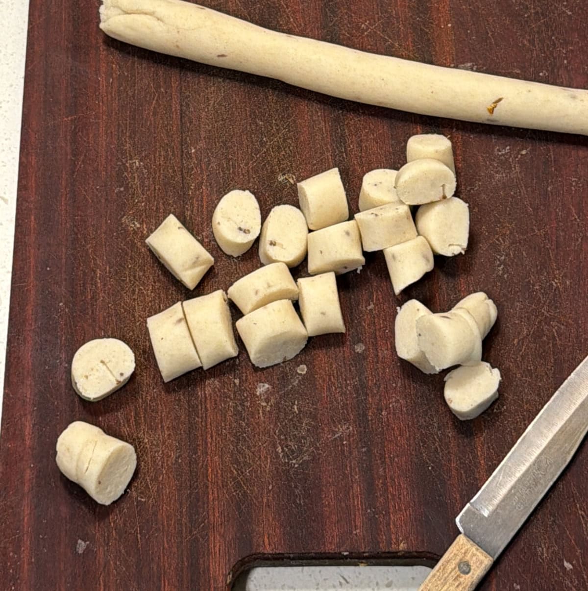 Seedai dough rolled into a log and cut into small pieces