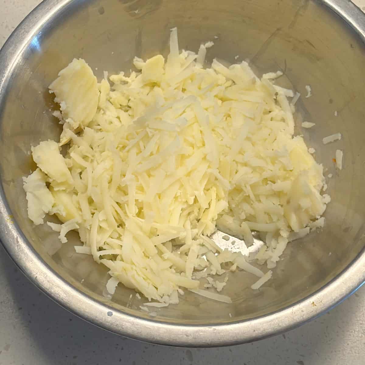 Boiled potatoes in a bowl for carrot potato cutlets