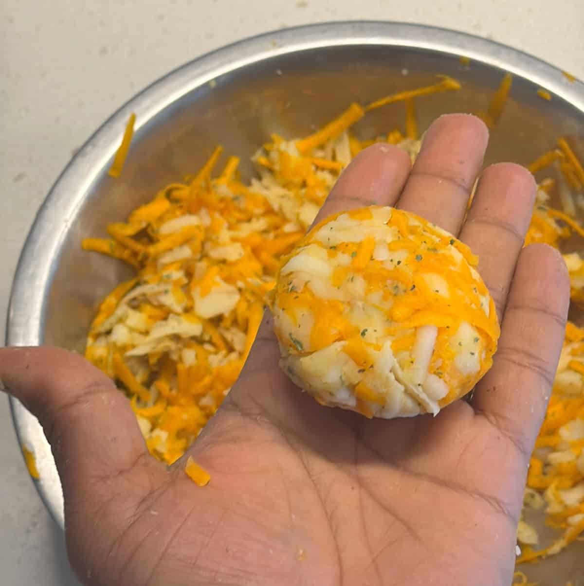 Carrot potato mixture shaped into a round cutlet