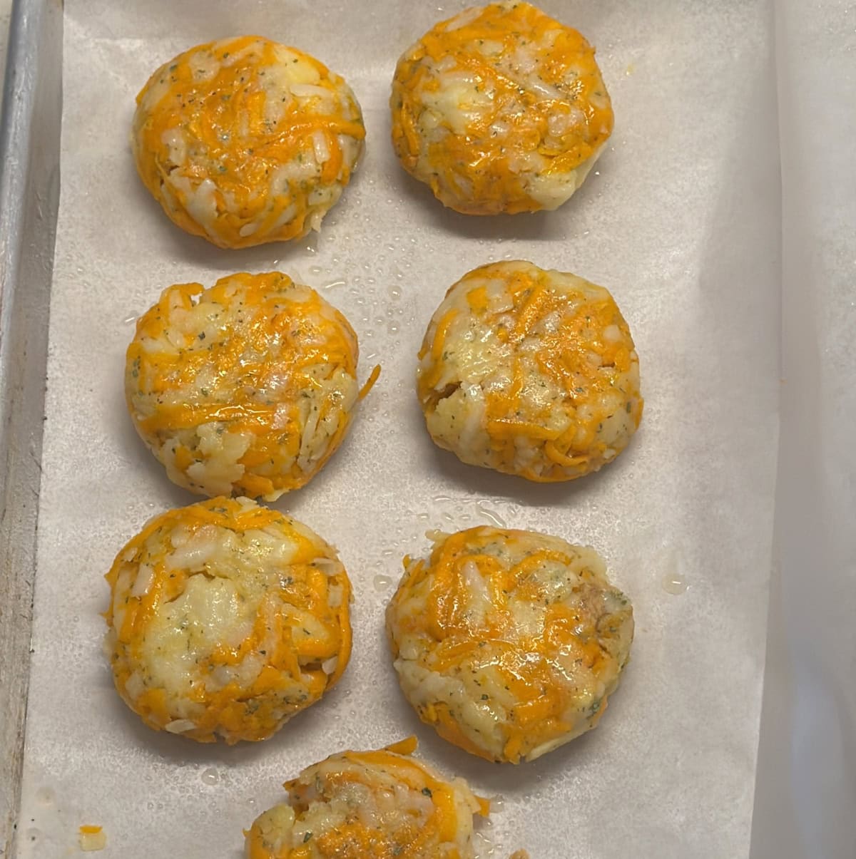 Shaped carrot potato cutlets arranged on a tray
