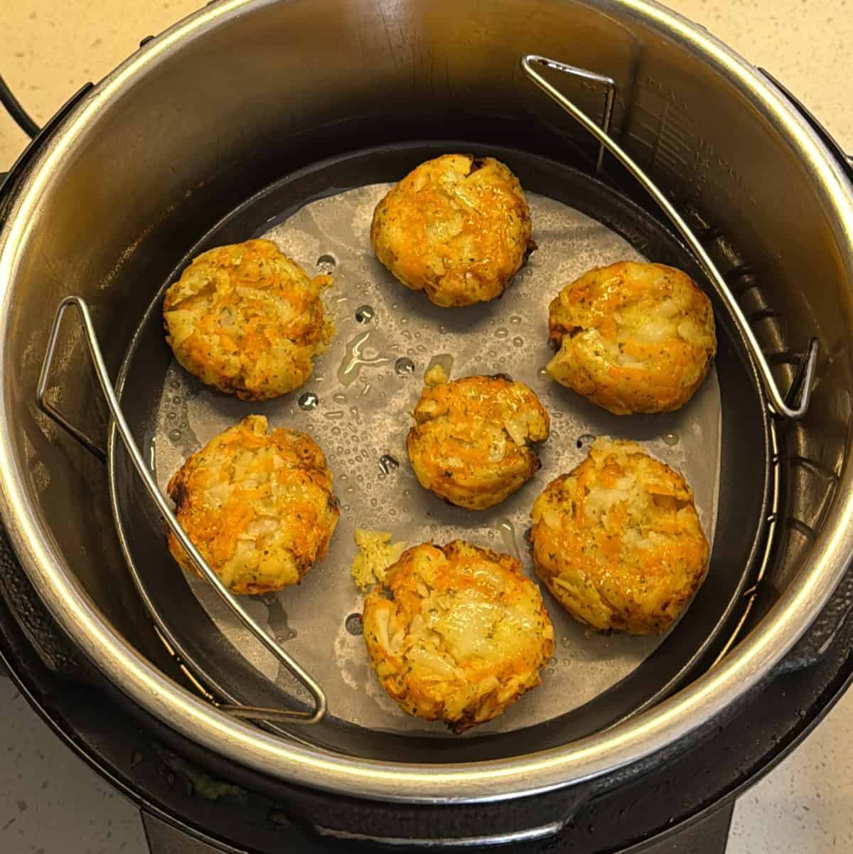 Carrot potato cutlets with browned edges after air frying