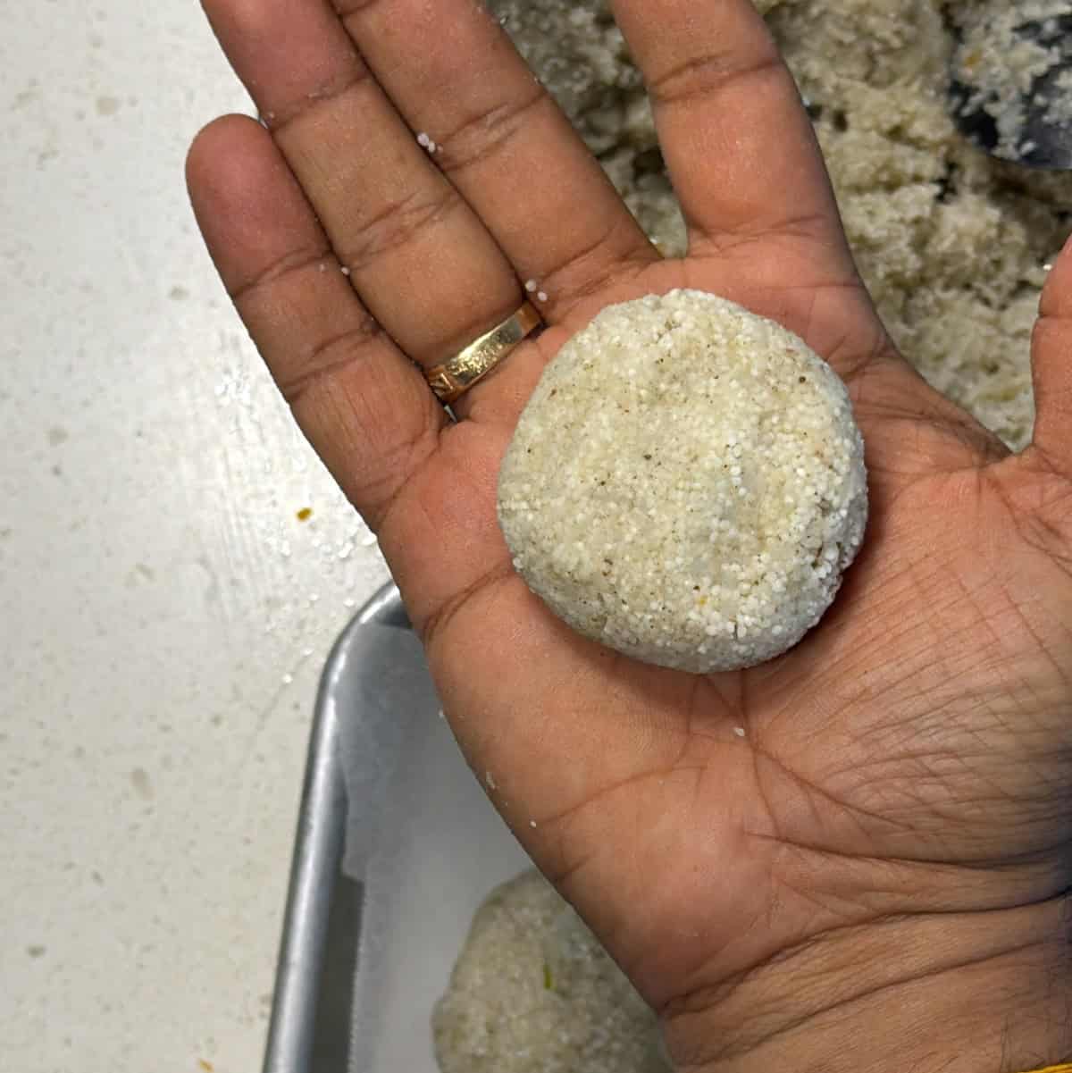 Sama rice and potato mixture shaped into a flat round cutlet