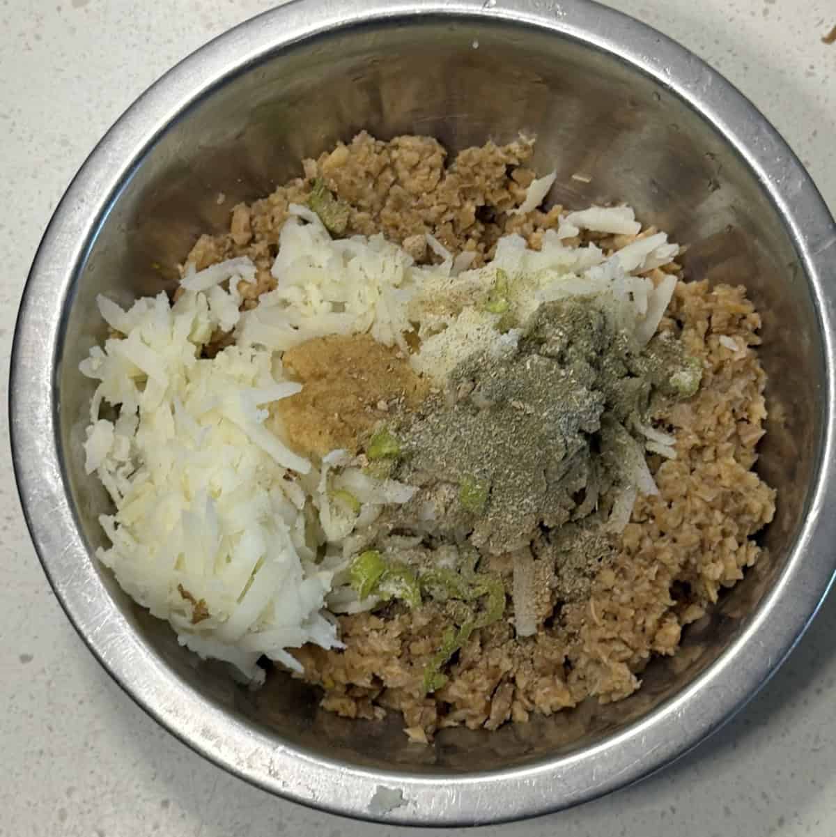 Grated potato and spices mixed with elephant yam for yam cutlets